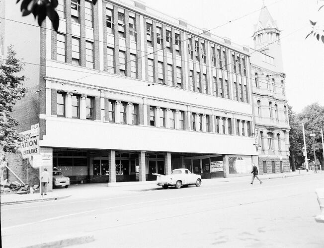 Monochrome photograph of a building exterior.