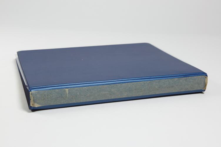 Photograph Album of harvesting equipment.