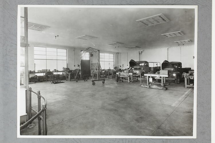 Monochrome photograph of a workshop.