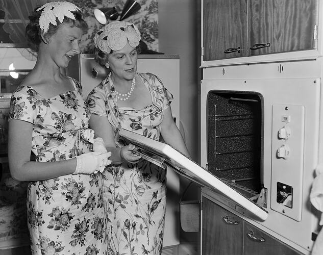 Two Women Looking in an Oven, Highett, Victoria, 26 Jan 1960