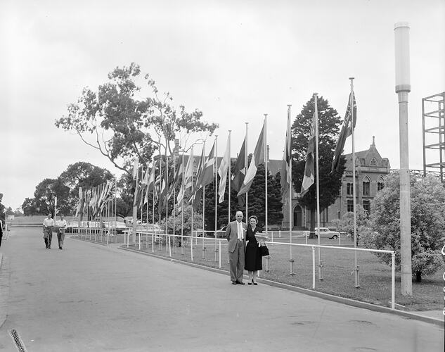 Congress of Scientific Management, Pair Standing Near Flags, Melbourne, 04 Mar 1960