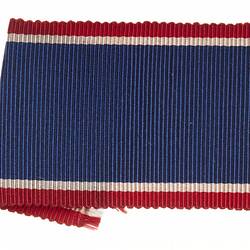 Ribbon with red, blue and white stripes.