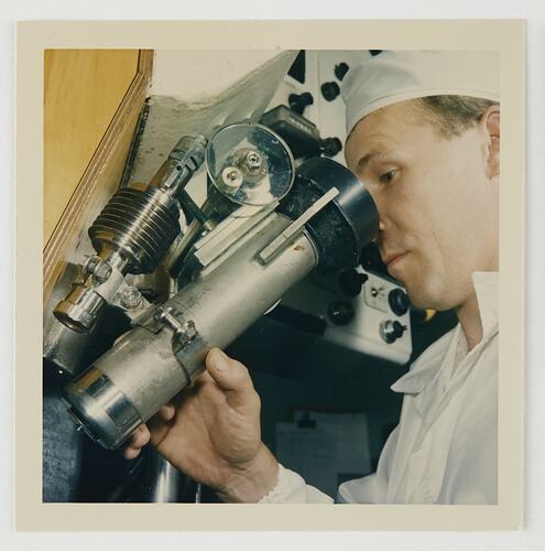 Slide 124, Worker Using Microscope, Kodak Factory, Coburg, 'Extra Prints of Coburg Lecture' album, circa 1960s