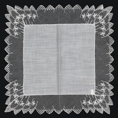 White handkerchief with net edging.