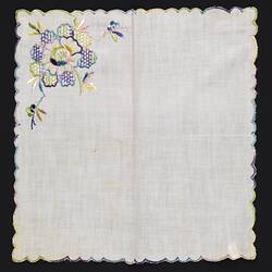 Unfolded white handkerchief with floral embroidery.