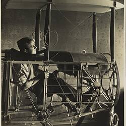 Photograph - Basil Watson Seated in Cockpit of Partially Constructed Biplane Fuselage in the Family Home, Elsternwick, Victoria, 1916