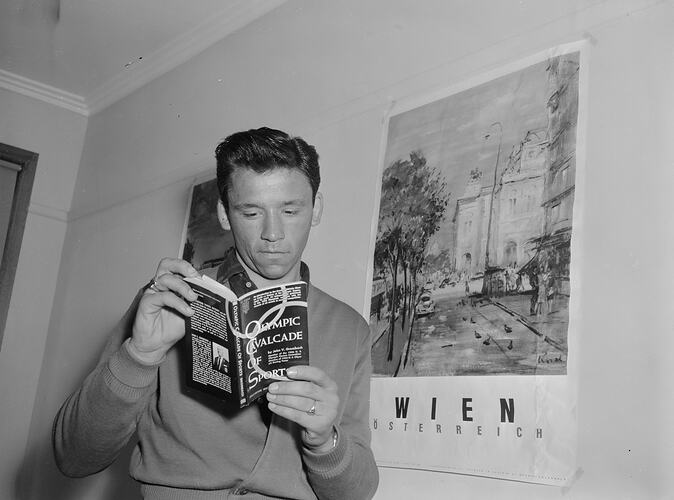 Austrian Olympic Athlete Reading From a Book Titled 'Olympic Cavalcade of Sports', Heidelberg West, Victoria, 1956