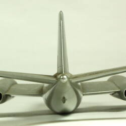 Silver model aeroplane. Rear view.