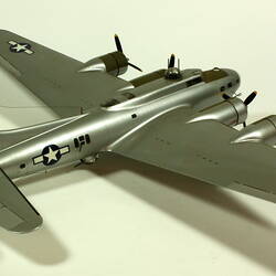 Silver model aeroplane. Three quarter back right view.