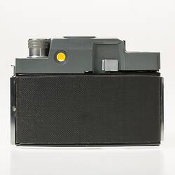Black, grey and silver, metal and plastic 35mm camera. Back view.