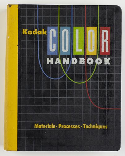 Black and yellow binder with coloured text and graphics on cover.