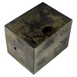 Black metal box (burnt).