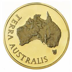Medal with a relief map of Australia. Text around.