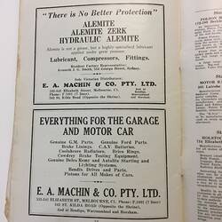 White catalogue page with two black printed car advertisements.