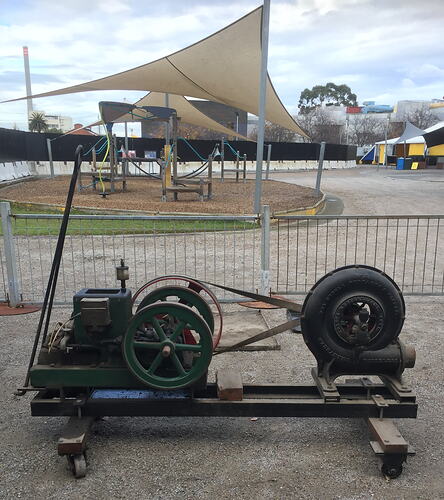 Engine and fan mounted on trolley frame.