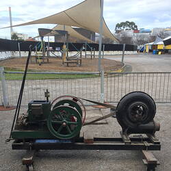 Engine and fan mounted on trolley frame.