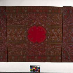 Finely woven red twill tapestry shawl with paisley design in red, orange, black, white and blue.