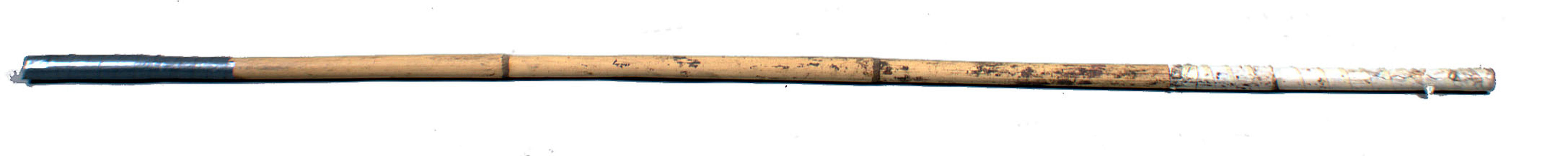 Long cane stick for prodding cattle.