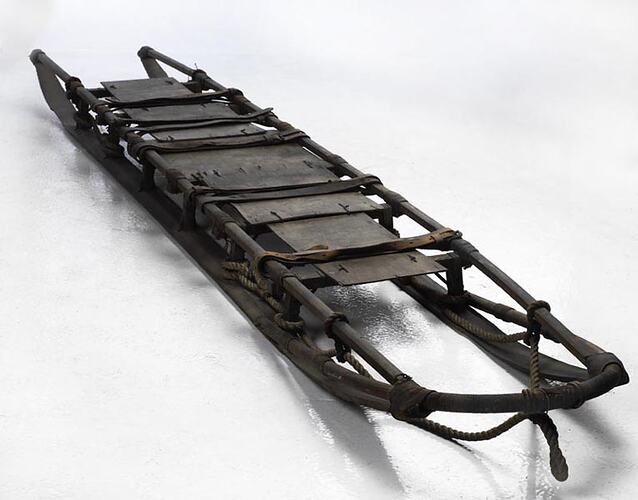 Long wooden sled.