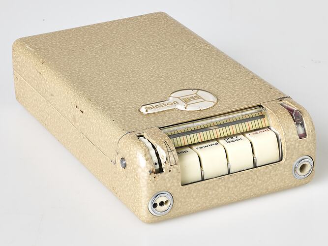 Rectangular cream metal case with four white labelled buttons at one end.