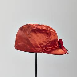 Red silk jockey cap.