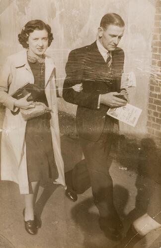 Digital Photograph - Woman & Man going to the Football, Richmond, 1938