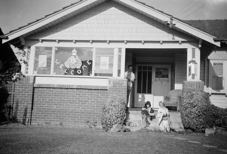Digital Photograph - Boy Standing & Two Girls Sitting on Front Verandah of Family Home, Decorated for Royal Visit, Ivanhoe, 1954