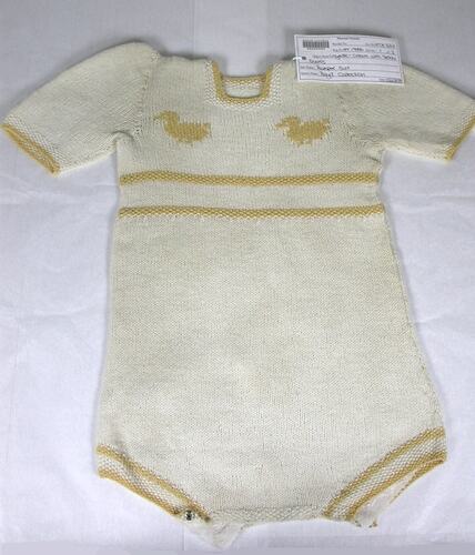 Knitted cream romper suite with ducks.