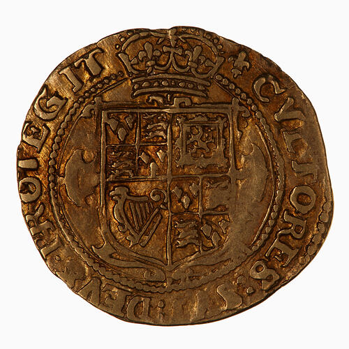 Coin, round, at centre crowned shield quartered with the arms of England, France, Scotland and Ireland.