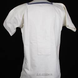 Back of square-necked white sailor's shirt.