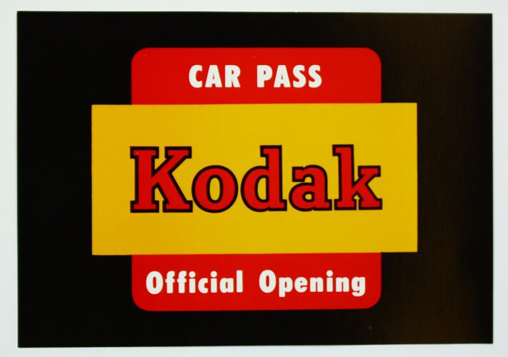 Car pass Kodak opening yellow black red white rectangle rounded off square.