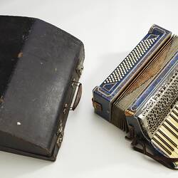 Blue piano accordion and case