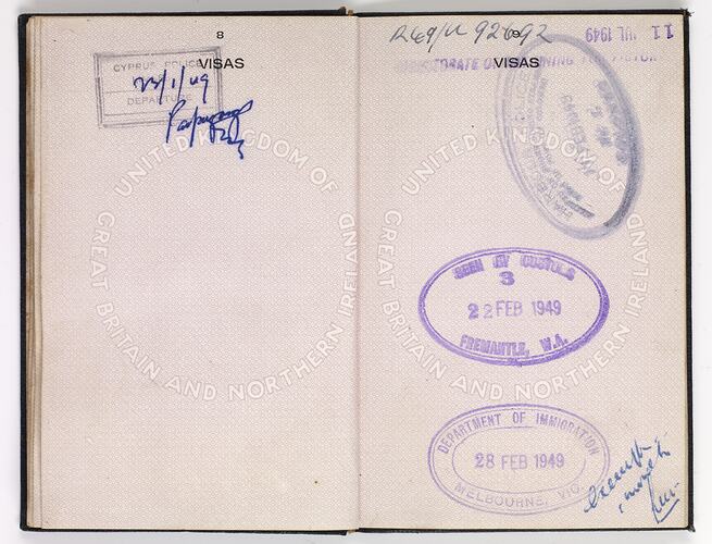 Open passport with white pages and black printing. Some handwriting. Stamped.
