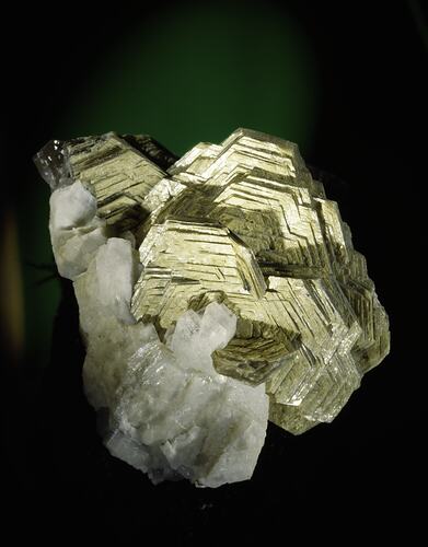 Creamy-yellow, hexagonal crystals on a white blocky crystal matrix.