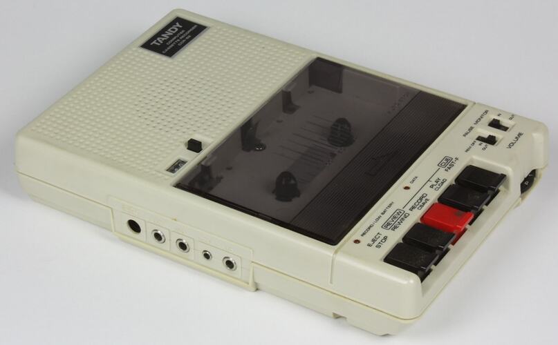 White cassette recorder with black buttons.