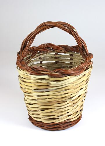 Brown and cream woven cane basket.