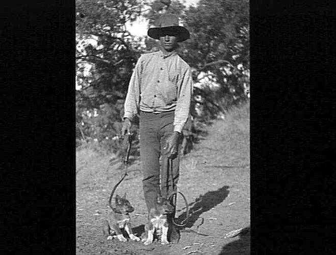Negative - Man with Two Puppies