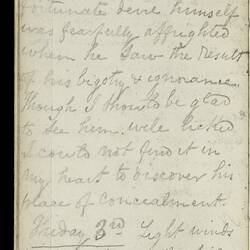 Open diary with handwritten text on discoloured worn page.