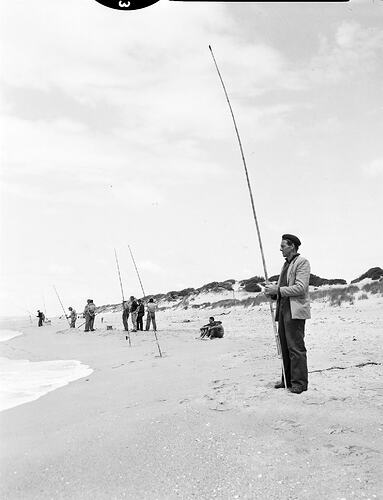 Monochrome photograph of a fishing competition.