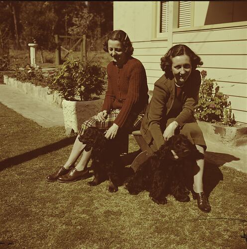 Women in Garden with Dogs, circa 1940s
