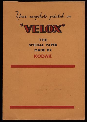 Yellow paper folder with red and black text.