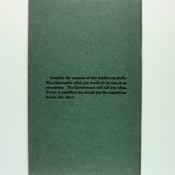 Back cover of green booklet with writing at centre