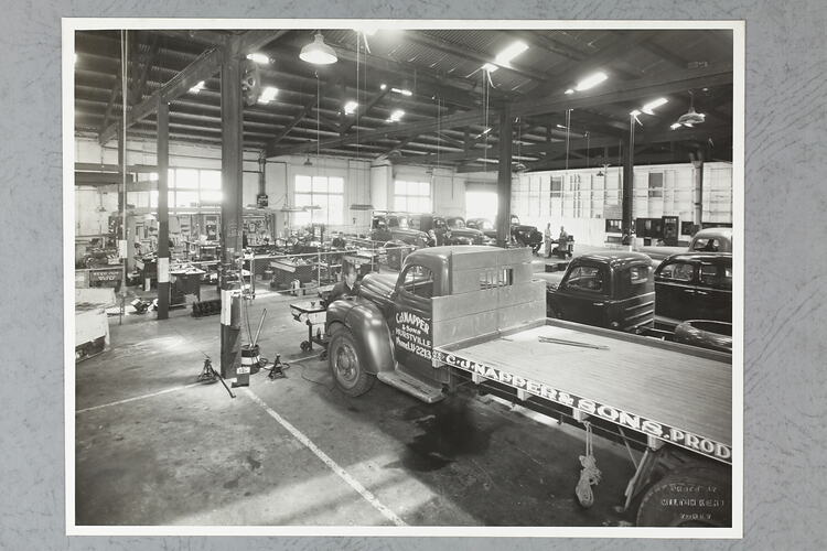 Monochrome photograph of a showroom interior.