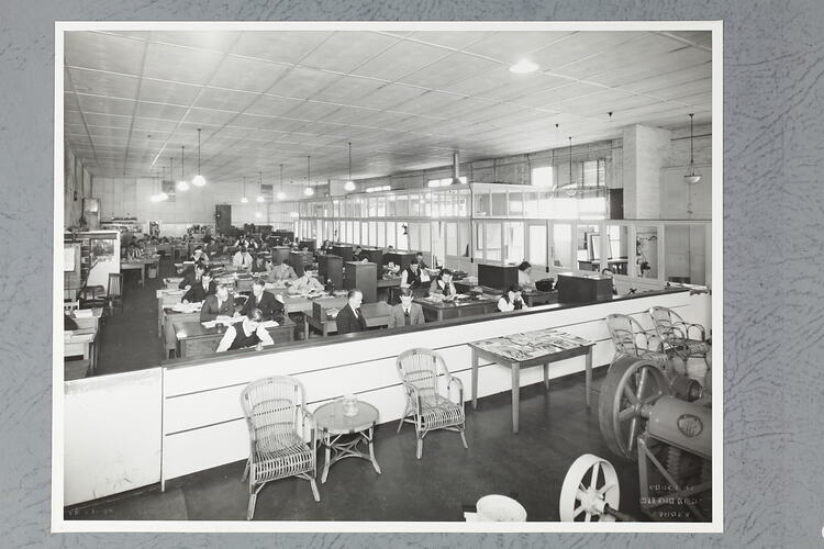 Monochrome photograph of an office interior.