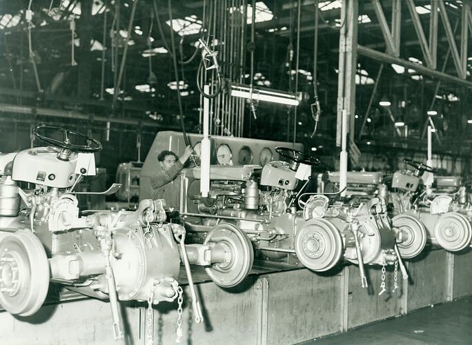 Diesel filling on tractor assembly line.