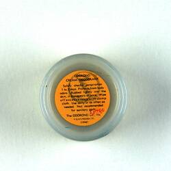 Underside of jar showing orange label.