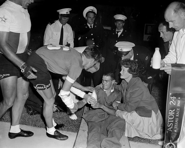 Man Tending to an Injured Cyclist, Melbourne, 23 Jan 1960