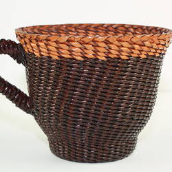 Woven and braided leather tea cup.