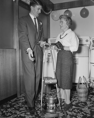 H. G. Palmer Pty Ltd, Man and Woman with Lawn Mower, Frankston, Victoria, Nov 1958