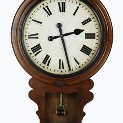 Wall clock with cedar drop dial case. White face with black Roman numerals and hands. Dial case lid off.